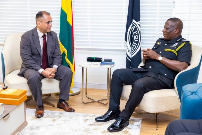 Mr. Christian Tetteh Yohuno, Inspector-General of Police of Ghana, in a discussion with the head of the NYPD team during their visit to the Police Headquarters in Accra.