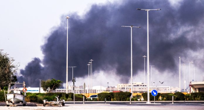 A plume of smoke rises from the Zayed Port following a reported Iranian strike in Abu Dhabi