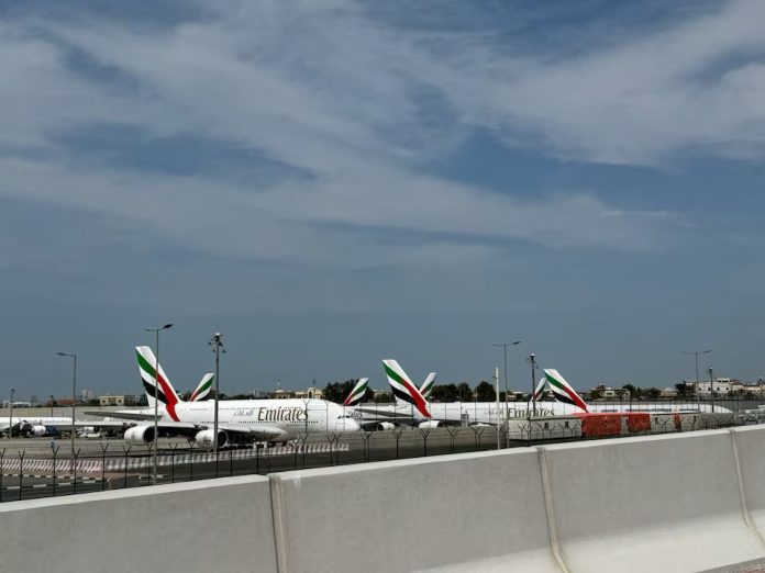 Emirates' planes sit on the tarmac of Dubai International Airport (DXB) after two drones came down in the vicinity of the airport, amid the U.S.-Israeli conflict with Iran, in Dubai, United Arab Emirates, March 11, 2026. Picture taken with a mobile phone. REUTERS/Stringer Purchase Licensing Rights