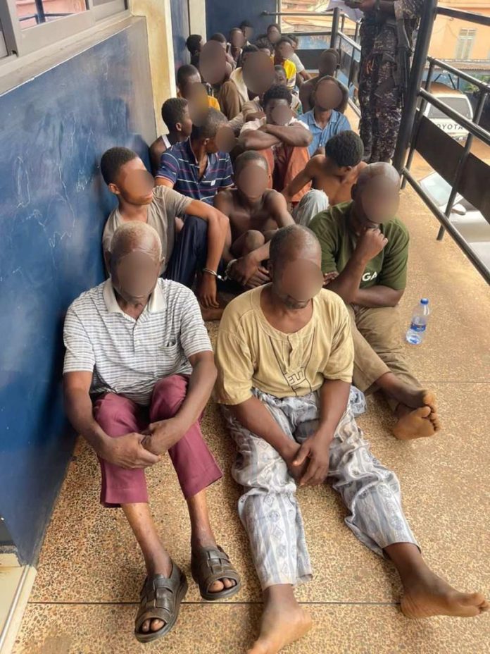 Suspects rounded up by security forces during a special operation at Sampa.