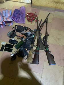Arms and ammunition reportedly retrieved from the suspects in police custody.