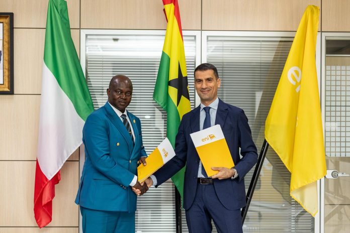 Managing Director of Eni, Maurizio Pinna (right), and Director-General of the Ghana Health Service, Prof. Samuel Kaba Akoriyea, exchange documents after signing an agreement during a meeting.