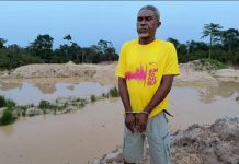 Pentecost Elder Arrested For Allegedly Doing Galamsey Elder David Bobie Peter in handcuffs after his arrest by NAIMOS over his alleged involvement in illegal mining (galamsey).