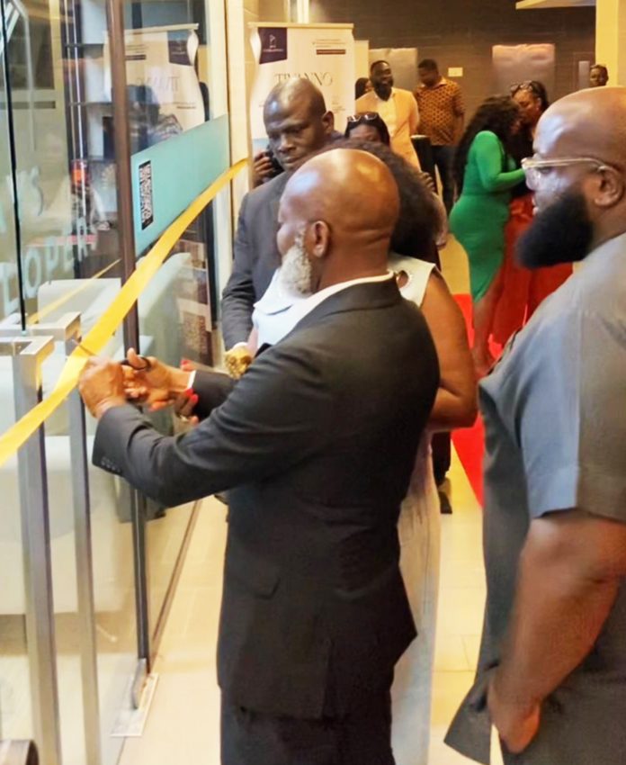 Augustine Ewiah (Executive Partner, AYS DEVELOPERS Africa) cutting the tape to commission the new office