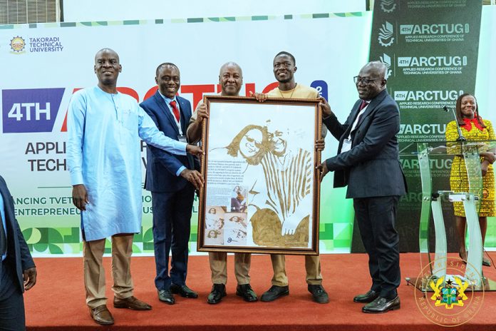 Authorities at the event present a citation to President John Dramani Mahama, featuring an image of the First Family, Mr. and Mrs. Mahama.