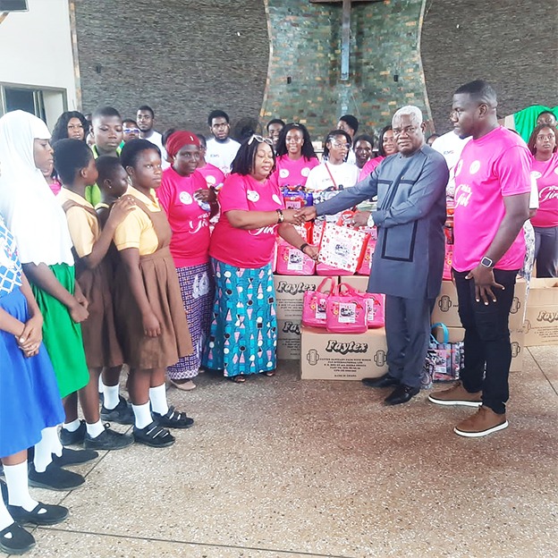 GES officials receiving the sanitary pads on behalf of the girls