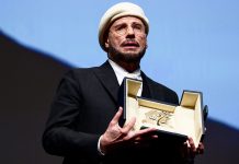 John Travolta cries after surprise award at Cannes Film Festival