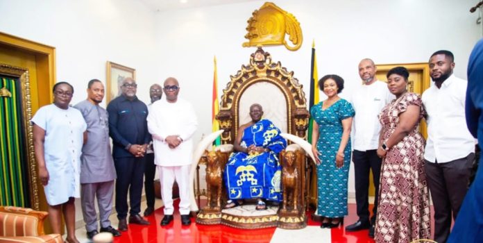 NHIA Board member and Otumfuo during the launch