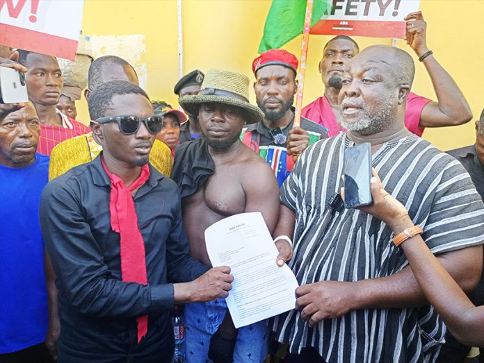 Nene Adela Ahaviatse Vleh II, the Divisional Chief of the Kudzragbe Clan, receiving the petition of the youth from Opesika