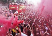 Arsenal fans turn streets red for victory parade