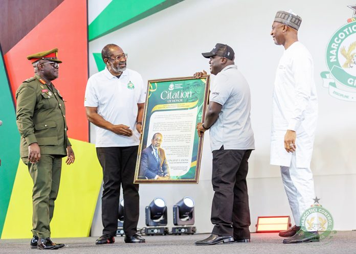A presentation of citation to a staff due for retirement as part of the world drug day celebration