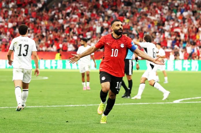 Egypt's Mohamed celebrates scoring his team's second goal