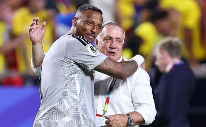 Eloy Room and Dick Advocaat celebrate a historic result for Curacao