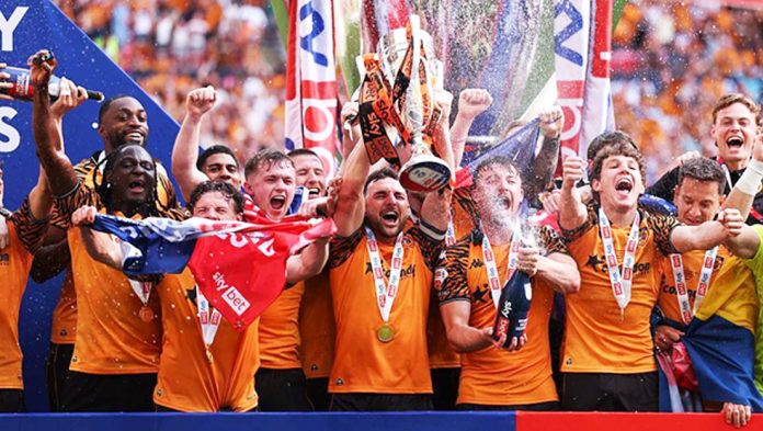 Hull City players celebrating with trophy