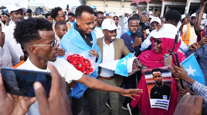 Omar Artan was greeted enthusiastically when he flew into Magadishu