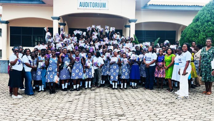 The APOWA members in a group photograph with the other dignitaries and the students during the ceremony at Aburi last Friday