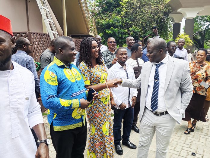WR Minister Joseph Nelson exchanging pleasantry with Health Officials