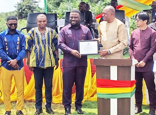 Labour Minister presenting Declaration form to Dr Frank Amoakohene while Atwima Mponua and Bibiani Anwiaso Bekwai MDCEs (left) look on