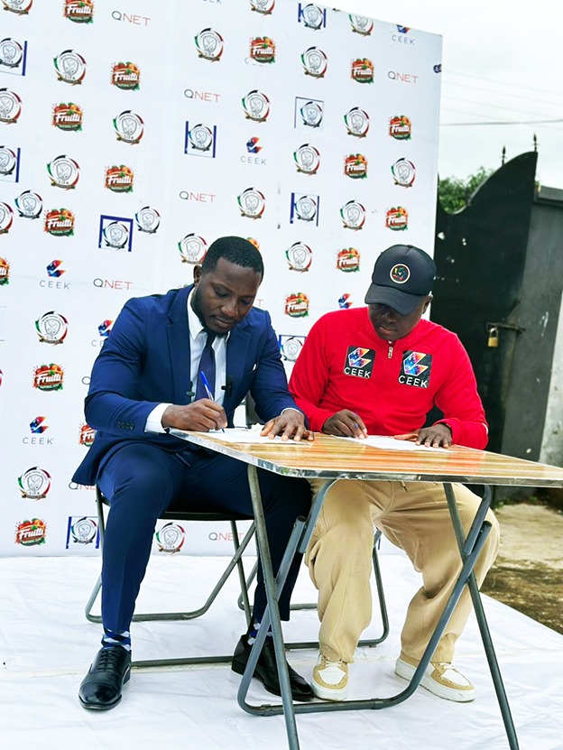 Mr Samuel Inkoom (R) and Lawrence Aubyn signing the agreement