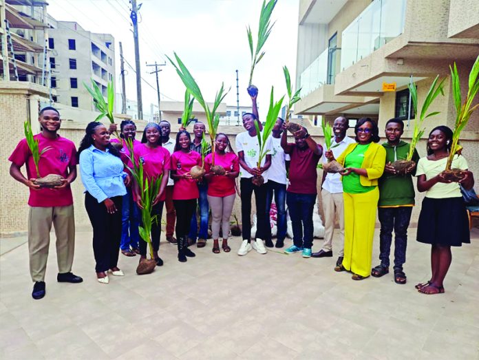 Page members displaying the coconut seedlings