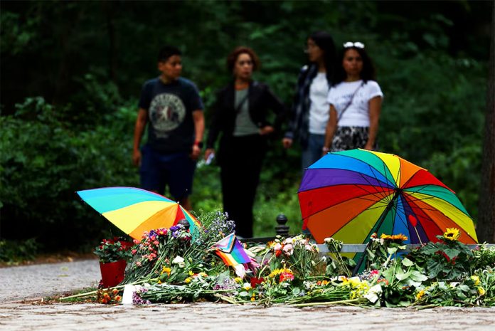 People visit a makeshift memorial after a deadly attack in which a vehicle crashed into a crowd near Berlin