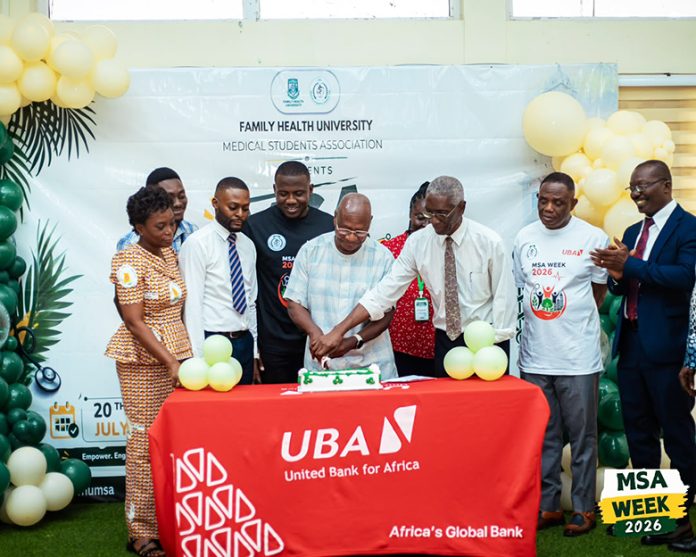Prof. Philip Odonkor, Pro VC Family Health University (3rd right) assisting Dr E K Labram to cut the cake while other dignitaries look on.