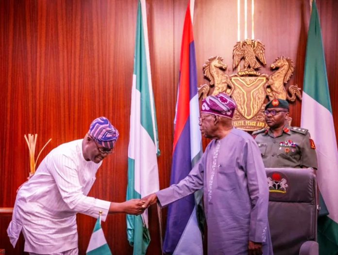 Head of the Civil Service of the Federation, Abel Enitan and President Bola Tinubu.