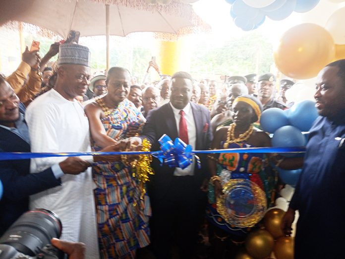 Bantamahene being assisted by Deputy Minister for Lands and Ashanti Regional Minister to officially open the new Minerals Commission Office