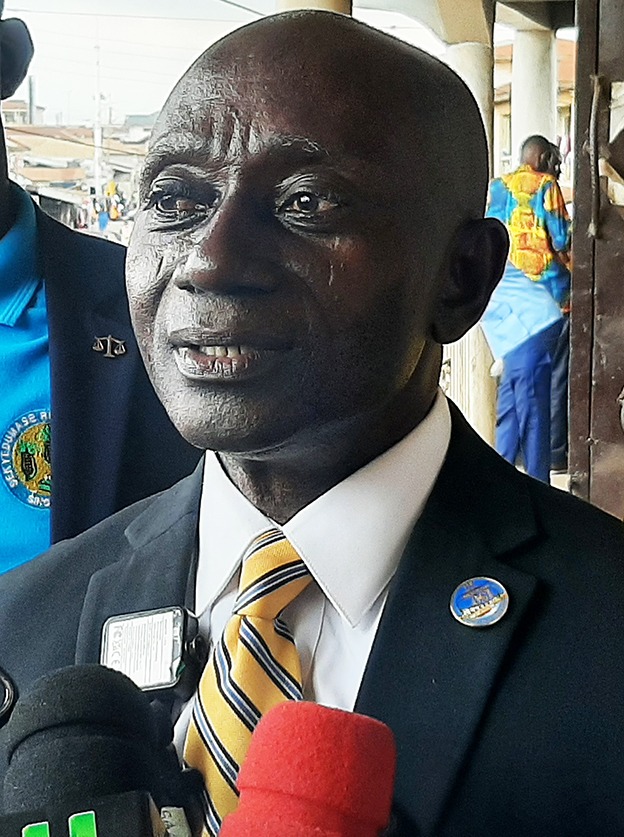 Dr. Dickson Osei-Assibey, Esq., interacting with the media