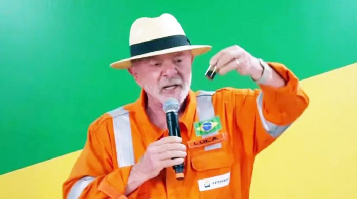 Lula held up a vial containing oil found as part of the exploratory drilling