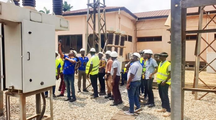 Participants being taken through the use of infrared thermography at a sub-station