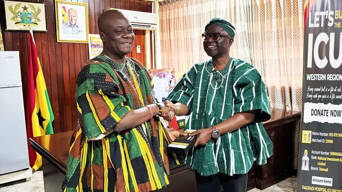WR Minister Joseph Nelson (left) receiving a package from the GEPA CEO
