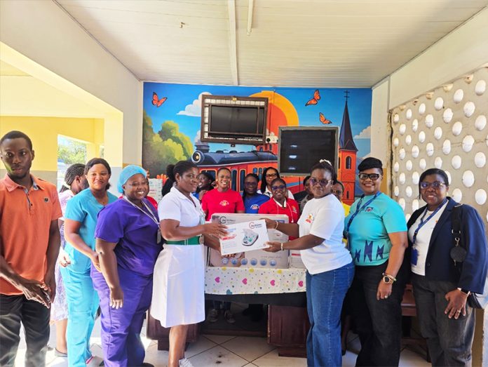 The Tema Region Power Queens Club making the presentation to the Tema Urban Hospital