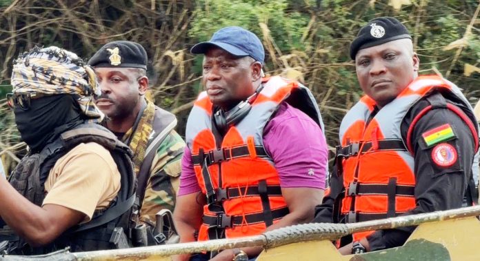 Lands and Natural Resources Minister, Emmanuel Armah-Kofi Buah, with the NAIMOS team
