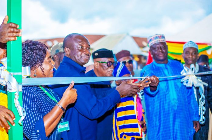 MCE Amankwah being assisted by Zongo Chiefs to Commission the facility