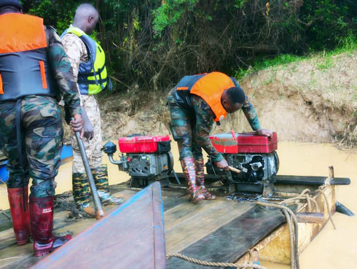 NAIMOS officials destroying machines on one of the water bodies