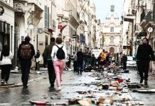 Burnt out cars and shattered glass on Paris streets after protests turn to riots and looting