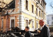 Kyiv bridge hit in further Russian drone attack as German chancellor makes surprise visit
